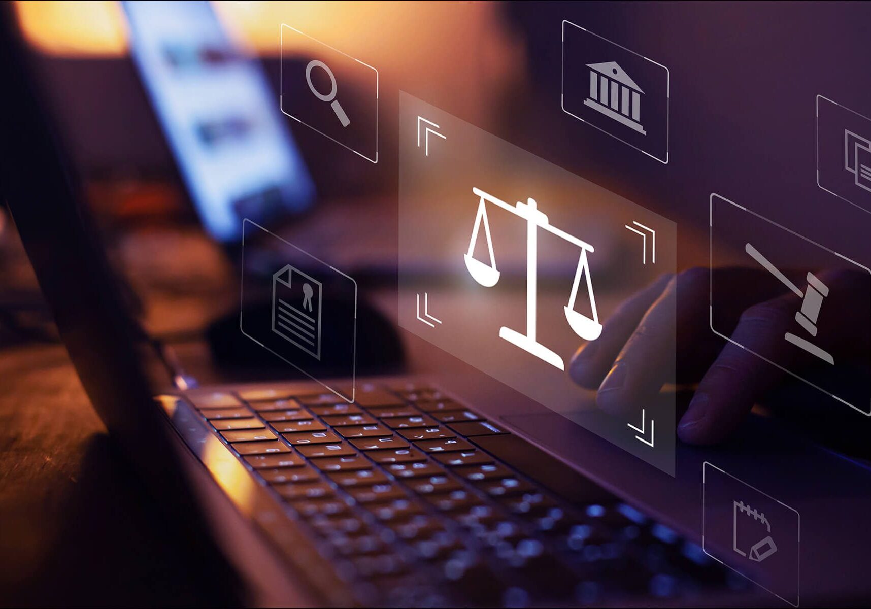 Scales of justice icon on laptop screen.